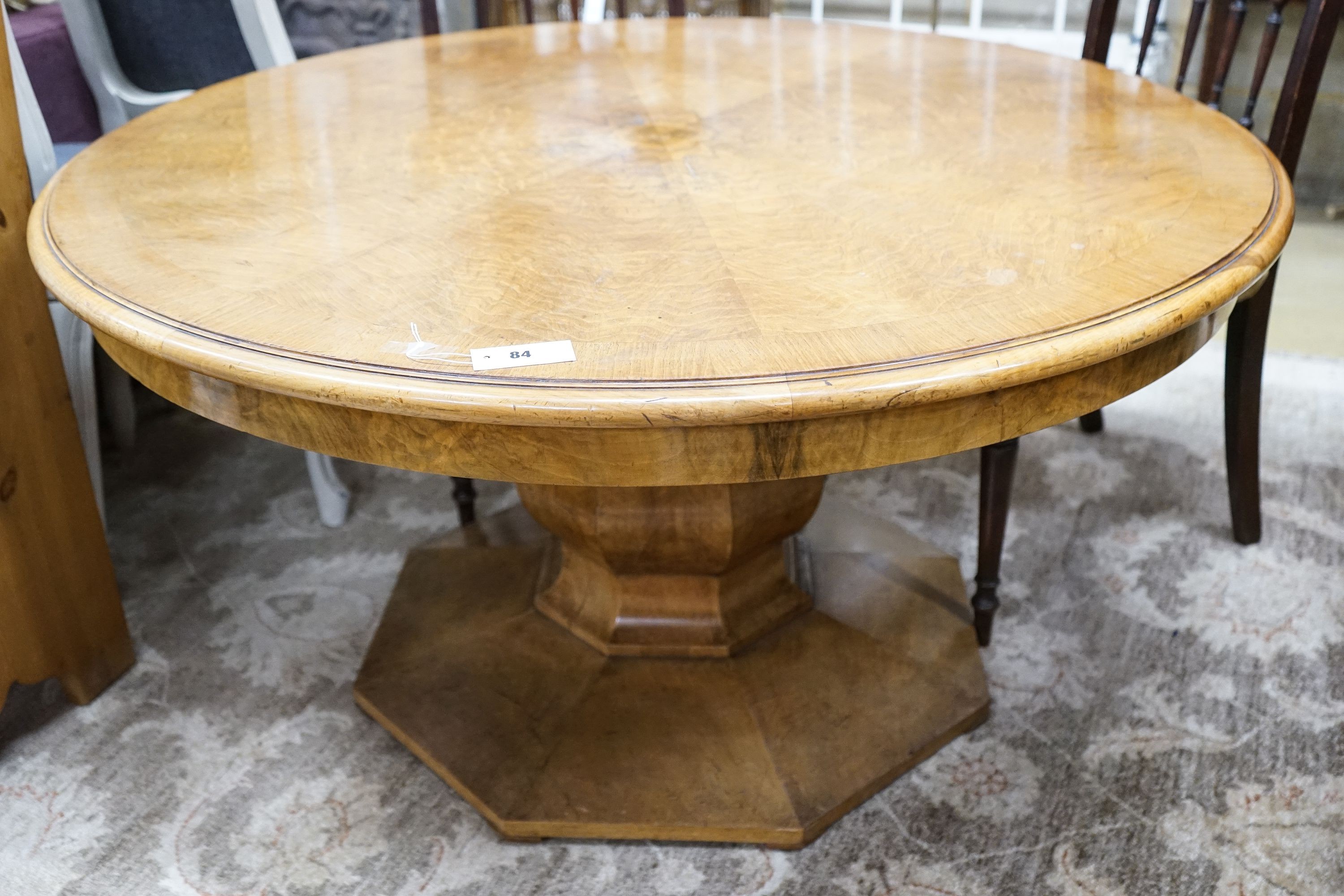 An Art Deco burr walnut circular low table with figured segmented veneered top, diameter 120cm, height 62cm